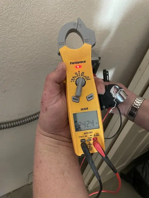 Voltage testing with clamp meter during Aluminum Wiring Replacement in Palm Coast
